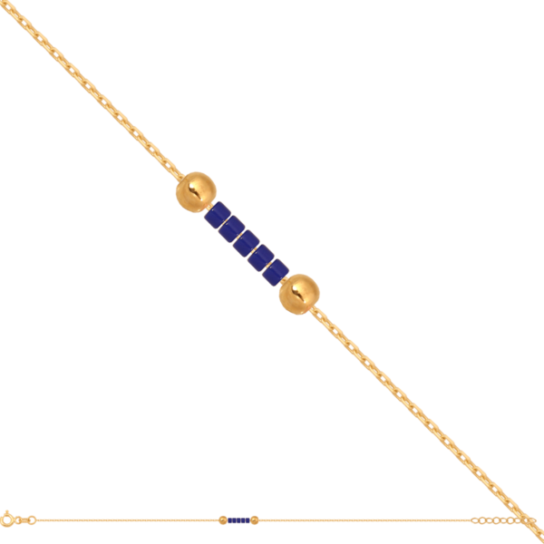 Delikatna bransoletka z przewleczonymi dwiema złotymi kuleczkami i granatowymi koralikami